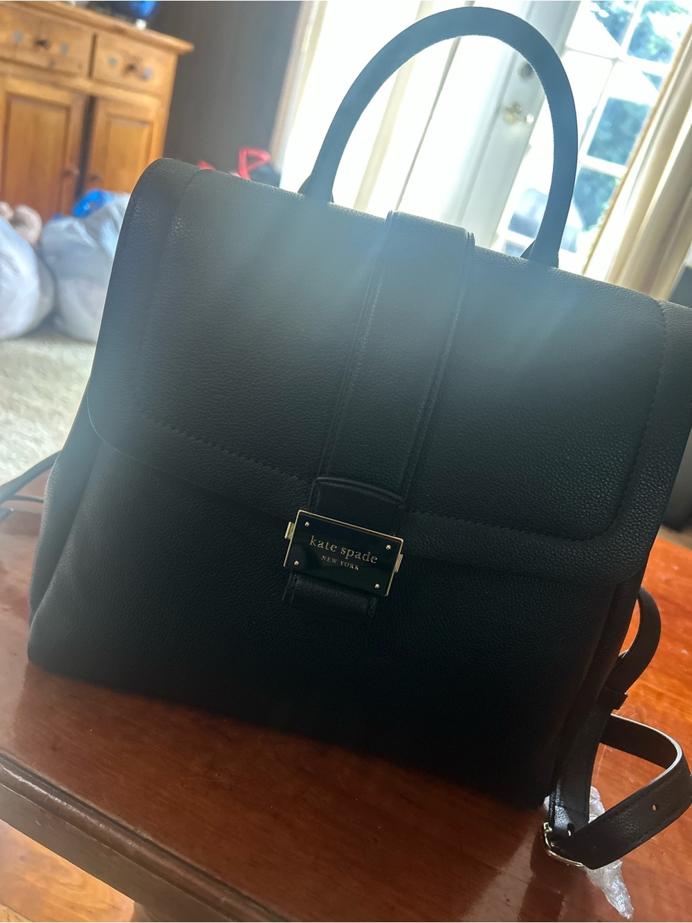 kate spade Black Pebbled Leather Messenger Bag with Gold Plaque